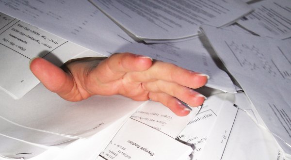 Businessman Overwhelmed with Paperwork Businessman Overwhelmed with Paperwork